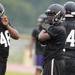 Members of the Ypsilanti Community High School football team practice in the rain at the school on Monday, August 12, 2013. Melanie Maxwell | AnnArbor.com